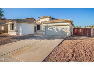 One-story house with a two-car garage and a gravel driveway at 6924 W Southgate Ave, Phoenix, AZ 85043