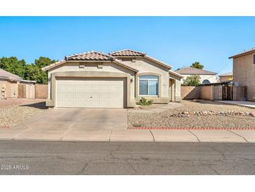 Single-story house with a two-car garage and landscaped front yard at 10932 W Morten Ave, Glendale, AZ 85307