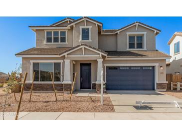 Two-story house with a gray exterior, blue garage door, and landscaping at 23472 S 210Th St, Queen Creek, AZ 85142