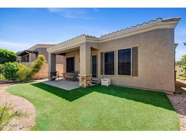 Covered patio and artificial turf backyard at 6202 E Mckellips Rd # 83, Mesa, AZ 85215