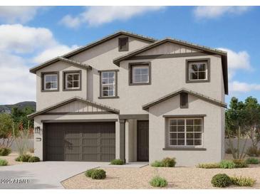 Two-story house with brown accents and a three-car garage at 32091 N Saddlehorn Dr, San Tan Valley, AZ 85140