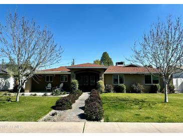 Ranch style home with mature trees and landscaped yard at 3213 N 41St Pl, Phoenix, AZ 85018