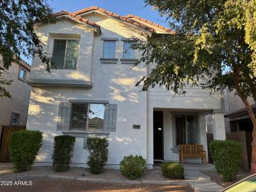 Two-story house with neutral siding, landscaping, and a welcoming porch at 3480 E Sheffield Rd, Gilbert, AZ 85296