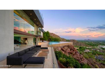 Modern home with infinity pool overlooking city and mountain views at 4949 E Red Rock Dr, Phoenix, AZ 85018