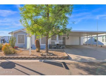 Single-story home with carport and landscaped yard at 8500 E Southern Ave # 506, Mesa, AZ 85209