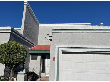 Close-up of townhouse entrance, showing architectural details and landscaping at 8719 N Fountain Dr, Peoria, AZ 85345