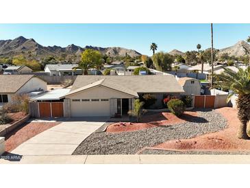 Single-story home with landscaped yard and mountain views at 10618 N 27Th St, Phoenix, AZ 85028