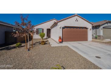 Single-story home with a two-car garage and desert landscaping at 12246 E Pivot Peak E --, Gold Canyon, AZ 85118