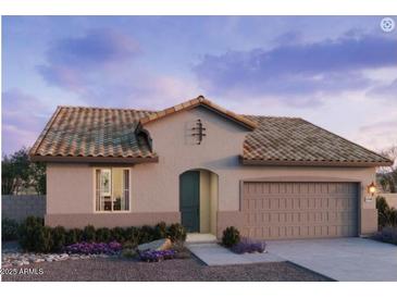 Single-story home with a tile roof, two-car garage, and landscaping at 25318 W Bowker St, Buckeye, AZ 85326