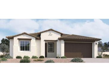 One-story home with brown garage door and Spanish-style detailing at 2657 E Abe Truckle Ave, San Tan Valley, AZ 85140