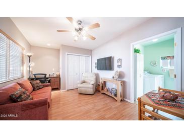 Cozy common area features a comfortable sofa and a flatscreen TV at 288 Diamond Dr, Apache Junction, AZ 85119