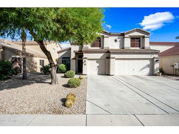 Two-story house with a large driveway and landscaped yard at 3448 W Sunshine Butte Dr, San Tan Valley, AZ 85144