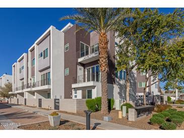 Modern three-story townhome with private balcony and gated entry at 4444 N 25Th St # 1, Phoenix, AZ 85016