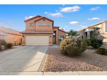 Two-story house with a landscaped yard and a two-car garage at 45583 W Sheridan Rd, Maricopa, AZ 85139