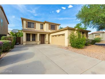 Charming two-story home with attached two-car garage and extended driveway at 60 W Beechnut Pl, Chandler, AZ 85248