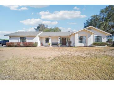 Single story home with front yard and landscaping at 6611 N 181St Ave, Waddell, AZ 85355