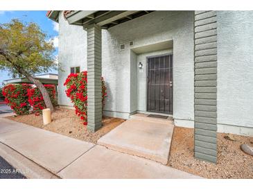 Inviting condo entry with landscaping at 2315 W Union Hills Dr # 115, Phoenix, AZ 85027