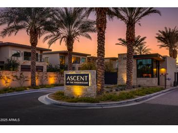 Community entrance with palm trees and Ascend at the Phoenician signage at sunset at 4849 N Camelback Ridge Dr # A101, Scottsdale, AZ 85251