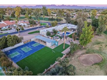 Luxury home with pool, sports court, and putting green, offering stunning mountain views at 5817 E Leith Ln, Scottsdale, AZ 85254