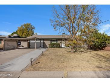 Single-story home with carport and landscaped yard at 616 W Toledo St, Chandler, AZ 85225