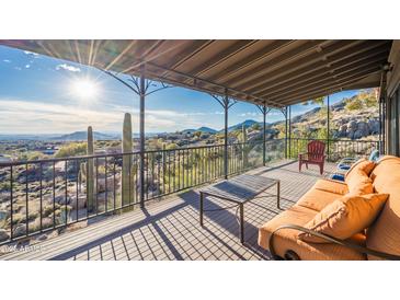 Covered deck with mountain views and comfortable seating at 11426 E Cottontail Rd, Cave Creek, AZ 85331