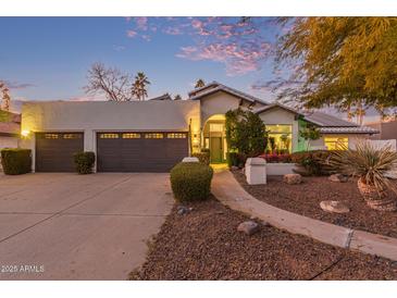 Beautiful desert home with three-car garage and landscaped yard at 12528 N 78Th St, Scottsdale, AZ 85260