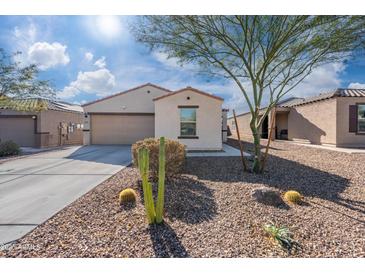 One-story house with desert landscaping and two-car garage at 12657 W Myrtle Ave, Glendale, AZ 85307