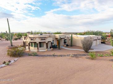 Stunning aerial view of a custom home with desert landscaping at 751 E Moon Vista St, Apache Junction, AZ 85119