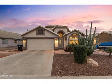 Single story home with attached garage and desert landscaping at 18807 N 2Nd Ave, Phoenix, AZ 85027
