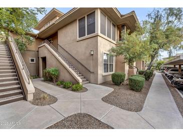 Attractive condo complex with beautiful desert landscaping and staircase access to the upper units at 20100 N 78Th Pl # 1062, Scottsdale, AZ 85255