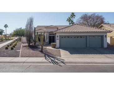 Single-story home with two-car garage and desert landscaping at 11503 W Cyprus Dr, Avondale, AZ 85392