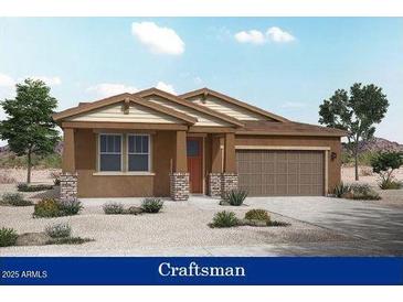 Craftsman style home with brown stucco and a two-car garage at 12722 W Luxton Ln, Avondale, AZ 85323