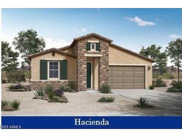 One-story home with stone accents and a two-car garage at 12725 W Luxton Ln, Avondale, AZ 85323