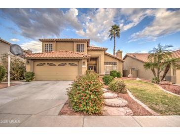 Two-story house with a landscaped yard and attached garage at 17009 S 30Th Way, Phoenix, AZ 85048