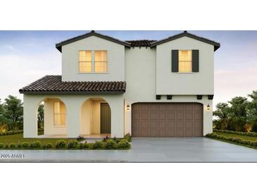 Two-story home with a brown garage door and arched entryway at 17219 W Vacaville St, Surprise, AZ 85388