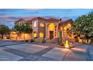 Stunning two-story home with Spanish-style architecture and landscaped yard at 17459 N 79Th St, Scottsdale, AZ 85255