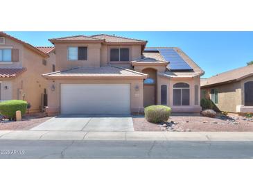 Two-story house with solar panels and desert landscaping at 21404 N Van Loo Dr, Maricopa, AZ 85138