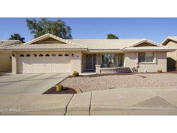 Single-story home with two-car garage and desert landscaping at 2544 S Daisy --, Mesa, AZ 85209