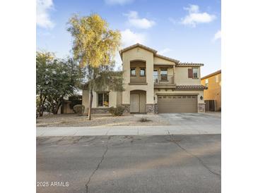 Two-story house with a large front yard and attached garage at 8709 W Hammond Ln, Tolleson, AZ 85353