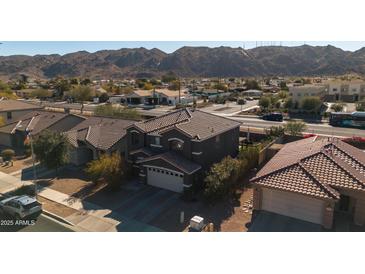 Two-story house aerial view, showcasing the property's curb appeal and neighborhood context at 109 E Milada Dr, Phoenix, AZ 85042