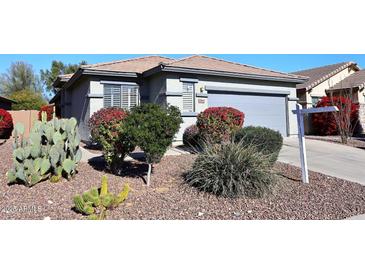 One-story home with landscaped yard and attached garage at 1780 W Morse Dr, Anthem, AZ 85086
