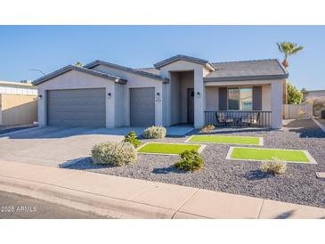 Single-story home with gray exterior, two-car garage, and landscaped front yard at 2743 N Lema Dr, Mesa, AZ 85215
