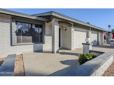 Brick house with two-car garage and landscaped front yard at 7950 E Keats Ave # 197, Mesa, AZ 85209