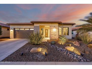 Single-story home with desert landscaping and a two-car garage at 13162 W Duane Ln, Peoria, AZ 85383