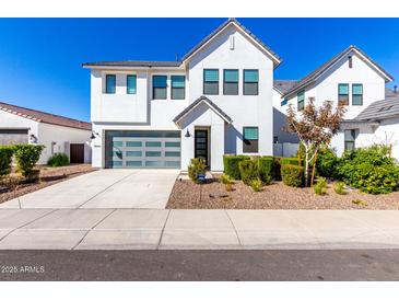 Two-story modern home with gray garage door and landscaped yard at 3600 W Cobalt Ct, San Tan Valley, AZ 85144