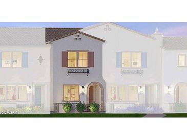 Two-story townhome with light-colored siding, arched entryway, and landscaping at 2658 S Sulley Dr # 108, Gilbert, AZ 85295