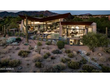 Luxury home with pool, desert landscaping, and mountain views at 38300 N 102Nd St, Scottsdale, AZ 85262