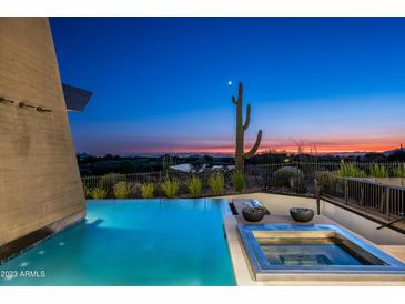 Infinity pool and spa with desert sunset views at 38300 N 102Nd St, Scottsdale, AZ 85262