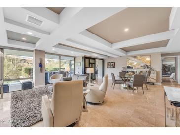 Spacious living room with floor to ceiling windows and modern furniture at 7117 E Rancho Vista Dr # 3006, Scottsdale, AZ 85251