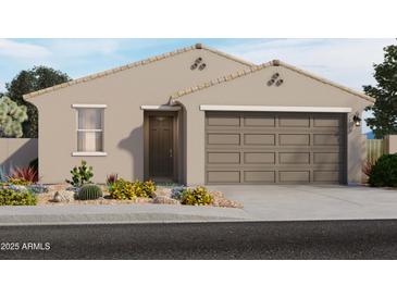 Single-story home with two-car garage and desert landscaping at 9102 N 174Th Ln, Waddell, AZ 85355